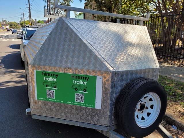 Medium Enclosed trailer for hire in Earlwood with side and back door entry.