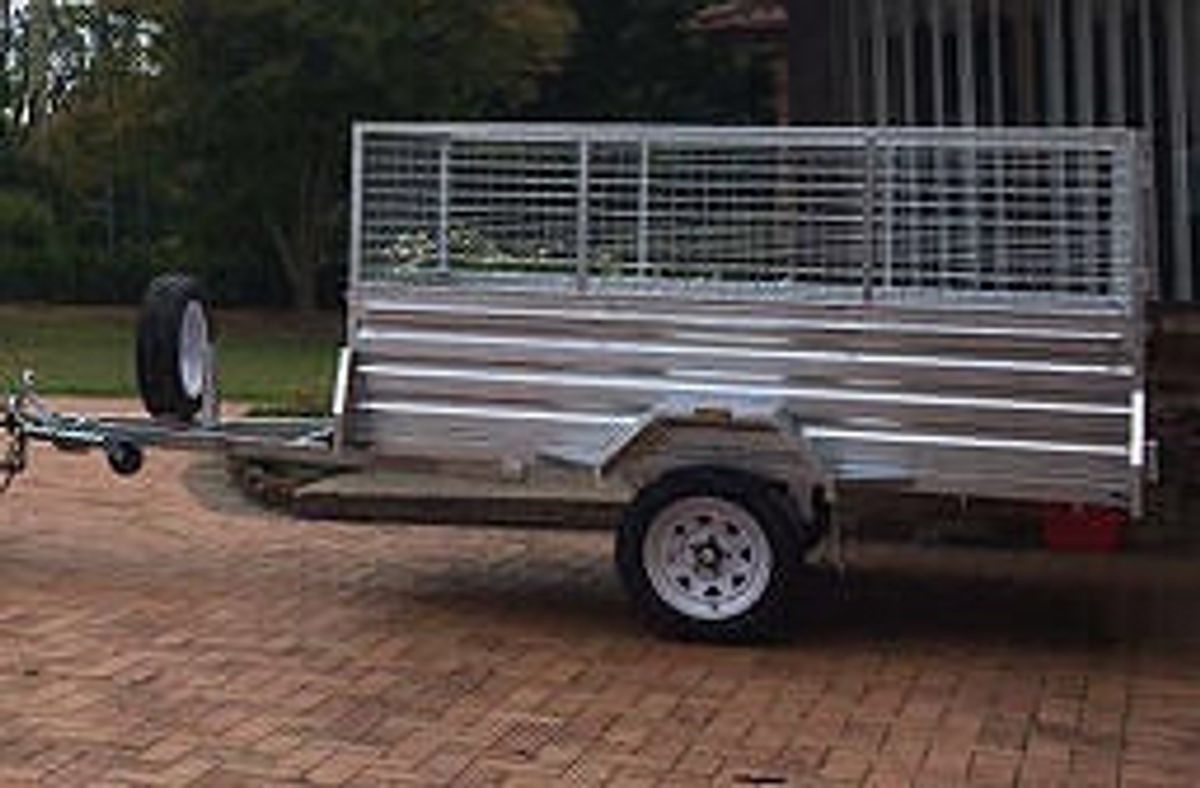 A 8x5 cage trailer with high side available for hire in North Gosford.