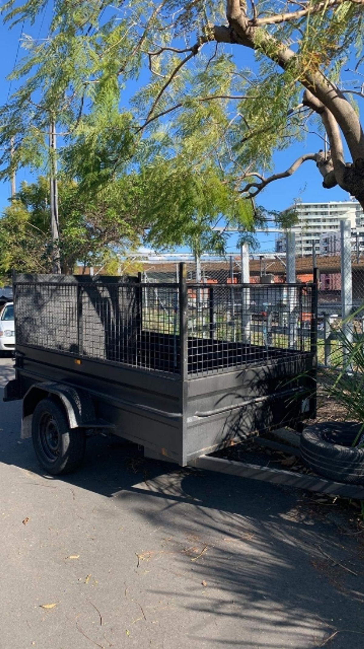 A cage trailer available for hire in North Strathfield.