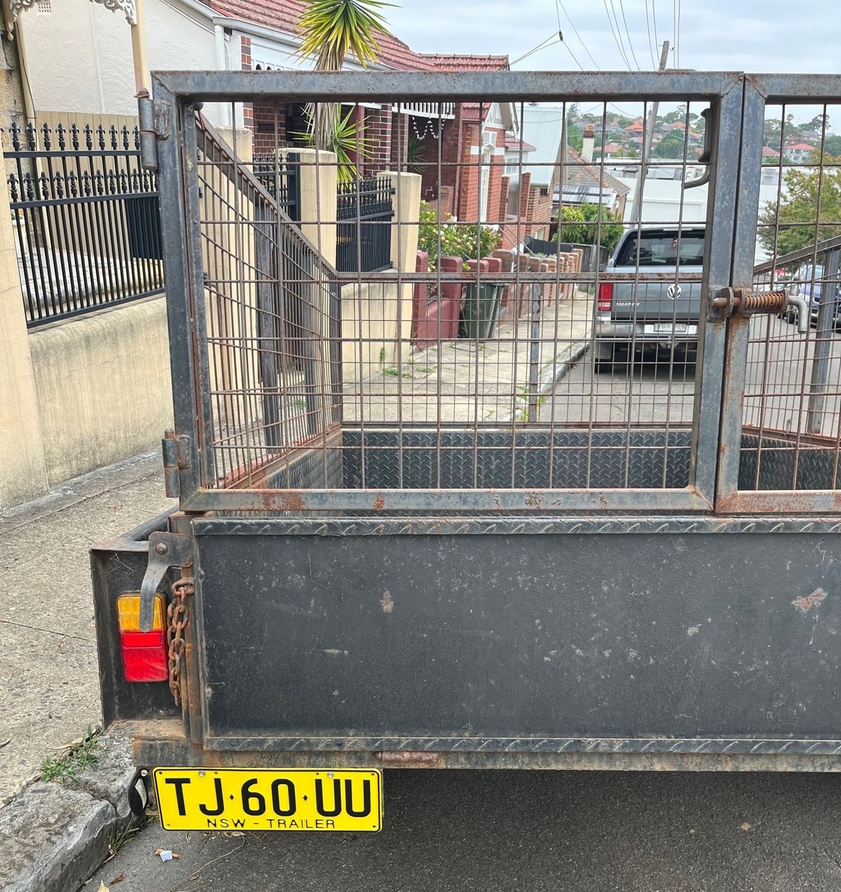 A cage trailer available for hire in Annandale.