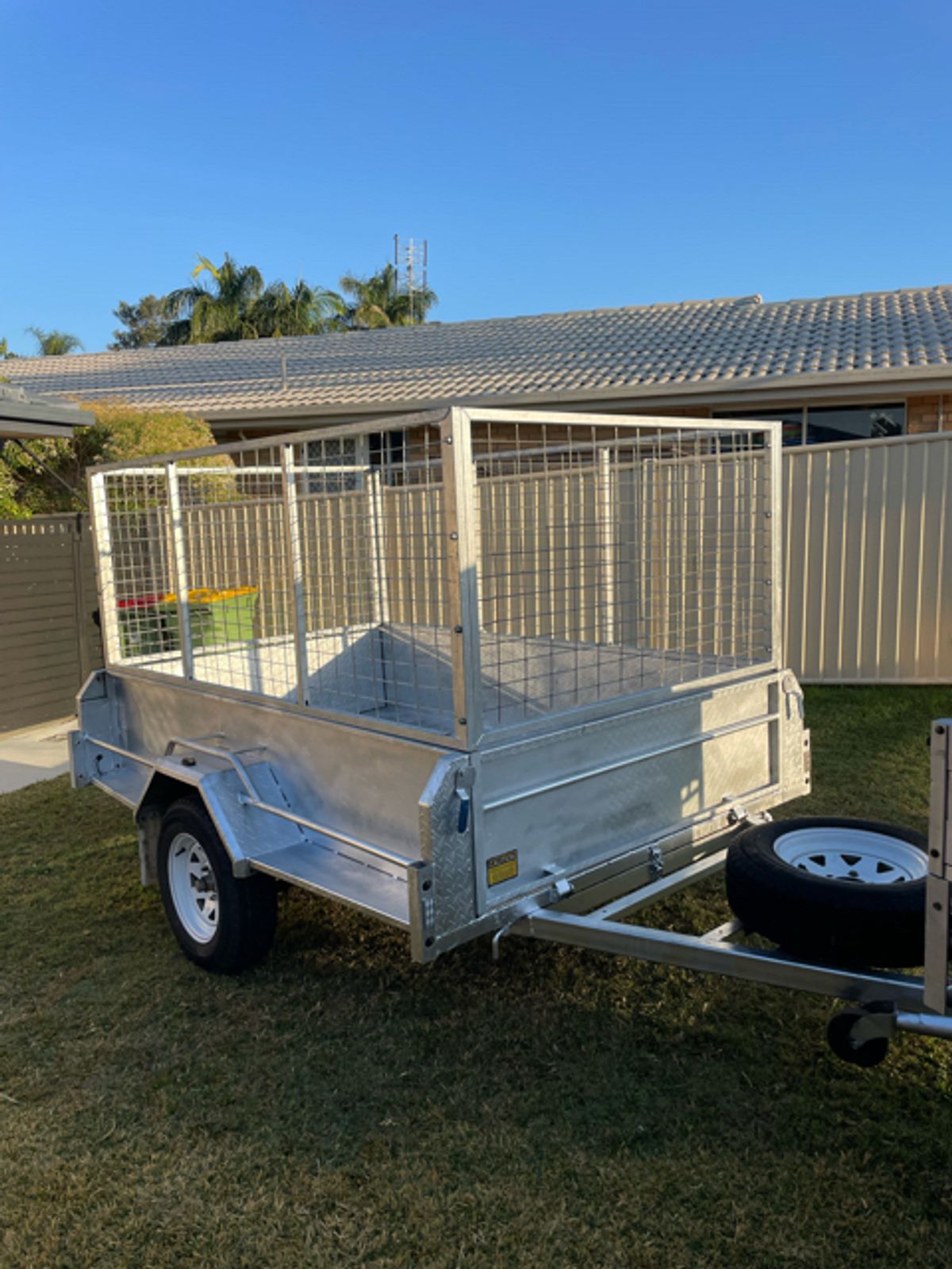 A 6 x4 cage trailer available for hire in Carrara.